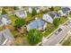 Inviting home featuring a blue roof, lush landscaping, and a well-manicured lawn at 1012 Delta River Way, Knightdale, NC 27545