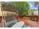 Back deck with hanging swing and table, perfect for relaxing outdoors at 1012 Delta River Way, Knightdale, NC 27545