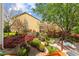 Backyard features mature trees, a koi pond, a stone pathway, and lush landscape at 1012 Delta River Way, Knightdale, NC 27545