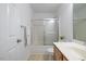 A clean bathroom featuring a shower-tub combo, vanity, and ample lighting at 1012 Delta River Way, Knightdale, NC 27545