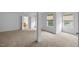 Spacious bedroom featuring neutral carpeting and a bathroom entrance for added convenience at 1012 Delta River Way, Knightdale, NC 27545