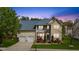 Charming two-story home featuring manicured lawn, two-car garage, and inviting curb appeal at 1012 Delta River Way, Knightdale, NC 27545