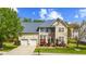 Charming two-story home featuring manicured lawn, two-car garage, and inviting curb appeal at 1012 Delta River Way, Knightdale, NC 27545