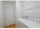 A tidy laundry room featuring a washer, dryer, and wire shelving for optimal storage at 1012 Delta River Way, Knightdale, NC 27545