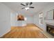 Open concept living area with hardwood floors, a fireplace, and a view into the kitchen at 1012 Delta River Way, Knightdale, NC 27545