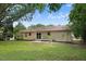 Spacious backyard featuring a patio area, well-maintained lawn, and a peaceful tree border at 103 Val Del Ct, Garner, NC 27529