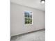 Neutral bedroom features a large window for natural light and neutral carpeting at 103 Val Del Ct, Garner, NC 27529