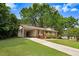 Charming home with brick facade, manicured lawn, and a welcoming covered porch at 103 Val Del Ct, Garner, NC 27529