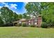 Inviting brick home with well-maintained lawn, dark shutters, and attractive landscaping at 103 Val Del Ct, Garner, NC 27529