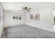 Bright living room featuring neutral walls, plush carpeting and modern ceiling fan at 103 Val Del Ct, Garner, NC 27529