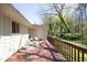 Outdoor deck with chairs, providing a relaxing space for enjoying the surrounding greenery at 103 Westview # H, Carrboro, NC 27510