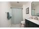 Stylish bathroom featuring a modern vanity, shower with curtain, and tasteful decor at 103 Westview # H, Carrboro, NC 27510
