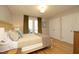 Serene bedroom with hardwood floors, natural light, and spacious closets at 103 Westview # H, Carrboro, NC 27510