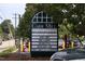 A Carr Mill sign showcases a variety of local businesses and dining options at 103 Westview # H, Carrboro, NC 27510