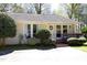 Charming single-story home with a well-manicured yard and inviting front porch at 103 Westview # H, Carrboro, NC 27510