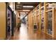 A vibrant hallway features unique shops, businesses, and artful decorations at 103 Westview # H, Carrboro, NC 27510