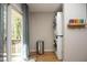 Convenient laundry area with stacked washer and dryer, and natural light from the sliding glass door at 103 Westview # H, Carrboro, NC 27510