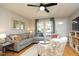 Comfortable living room with a stylish sofa, patterned chairs, and ample natural light at 103 Westview # H, Carrboro, NC 27510