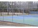 A fenced, outdoor tennis court offers residents recreational opportunities within the community at 103 Westview # H, Carrboro, NC 27510