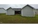 Backyard featuring gray siding and a covered patio at 104 Oakfield Trace Dr, Four Oaks, NC 27524