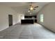 Open-concept living room and kitchen with modern finishes, a vaulted ceiling, and plenty of natural light at 104 Oakfield Trace Dr, Four Oaks, NC 27524