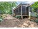 Back porch with natural views, situated on a lot with mature trees and landscaping at 109 Jasmine Rose Ct, Holly Springs, NC 27540