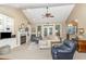 Bright living room with vaulted ceilings, fireplace, and neutral decor at 109 Jasmine Rose Ct, Holly Springs, NC 27540