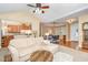 Spacious living room with fireplace, open floor plan, and view of dining area at 109 Jasmine Rose Ct, Holly Springs, NC 27540