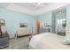 Spacious main bedroom with a seating area and ensuite bathroom with updated fixtures at 109 Jasmine Rose Ct, Holly Springs, NC 27540