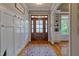 Spacious foyer with hardwood floors, coat hooks, a decorative rug, and ample natural light at 1161 Golden Star Way, Wake Forest, NC 27587