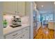 Modern kitchen with stainless steel refrigerator, white subway tile backsplash, and ample counter space at 1161 Golden Star Way, Wake Forest, NC 27587