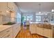 Open-concept kitchen with white countertops, stainless steel appliances, and a view of the dining area at 1161 Golden Star Way, Wake Forest, NC 27587