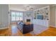 Cozy living room with a fireplace, built-in shelving, and hardwood flooring at 1161 Golden Star Way, Wake Forest, NC 27587
