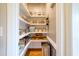 Walk-in pantry featuring custom shelving and organized storage solutions at 1161 Golden Star Way, Wake Forest, NC 27587
