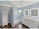 Beautiful primary bathroom with double vanity, walk-in shower, and modern fixtures at 117 Brierridge Dr, Apex, NC 27502