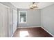 Bedroom featuring natural light, neutral decor, and a modern ceiling fan at 117 Brierridge Dr, Apex, NC 27502