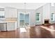 Open concept kitchen with stainless steel appliances and an adjacent dining area at 117 Brierridge Dr, Apex, NC 27502