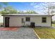 Exterior view of backyard with gravel, patio and lawn at 1204 Pecan Pl, Durham, NC 27704