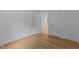 Bright bedroom with new flooring, neutral walls, and closet at 1204 Pecan Pl, Durham, NC 27704