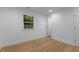Cozy bedroom with natural light and wood-look flooring offers a peaceful retreat at 1204 Pecan Pl, Durham, NC 27704