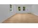 Spacious living room with natural light, neutral walls and floors at 1204 Pecan Pl, Durham, NC 27704