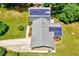 Aerial view of the home featuring solar panels, a well-maintained lawn, and a driveway at 1209 Locharron Ln, Cary, NC 27511