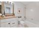 Bathroom featuring granite countertops, tile floors and a shower-tub combo at 1209 Locharron Ln, Cary, NC 27511