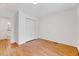 Bedroom featuring hardwood floors and a large closet, with an attached bathroom at 1209 Locharron Ln, Cary, NC 27511