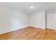Bedroom with hardwood floors and a large closet at 1209 Locharron Ln, Cary, NC 27511
