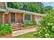Brick home with a well-manicured garden and charming front entrance at 1209 Locharron Ln, Cary, NC 27511