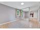 Bright living room showcasing tile floors, neutral walls, and a decorative fireplace at 1209 Locharron Ln, Cary, NC 27511