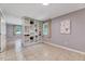 Open-concept living room with built-in shelving and ample natural light from multiple windows at 1209 Locharron Ln, Cary, NC 27511