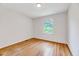 Clean bedroom with hardwood floors and natural light streaming through window at 1209 Lochcarron Ln, Cary, NC 27511