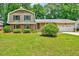 Charming brick home with well-maintained lawn and mature landscaping at 1209 Lochcarron Ln, Cary, NC 27511